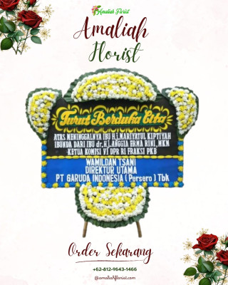 Papan Bunga Duka di Panggung Rawi